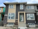322 Sundown Road, Cochrane, AB  - Outdoor With Facade 
