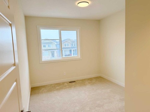 322 Sundown Road, Cochrane, AB - Indoor Photo Showing Other Room