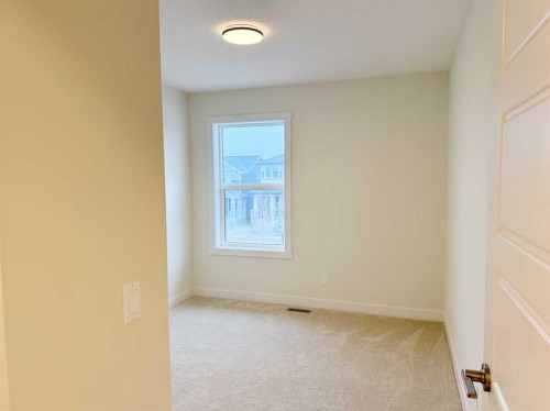 322 Sundown Road, Cochrane, AB - Indoor Photo Showing Other Room