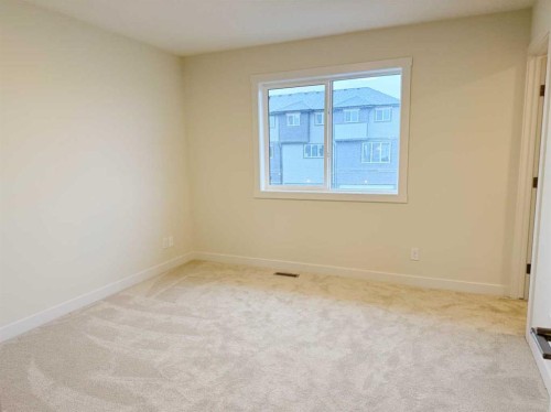 322 Sundown Road, Cochrane, AB - Indoor Photo Showing Other Room