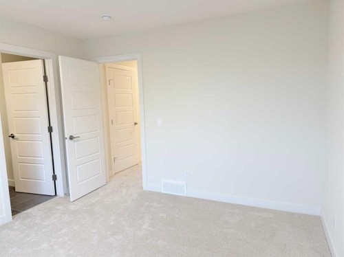 322 Sundown Road, Cochrane, AB - Indoor Photo Showing Other Room