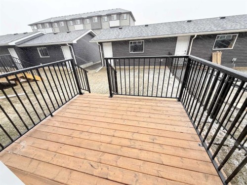 322 Sundown Road, Cochrane, AB - Outdoor With Deck Patio Veranda With Exterior