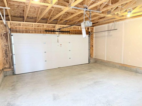 322 Sundown Road, Cochrane, AB - Indoor Photo Showing Garage
