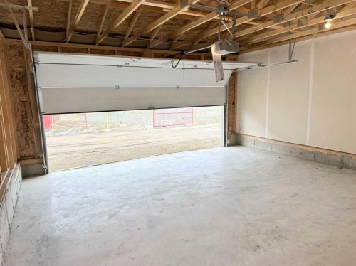 322 Sundown Road, Cochrane, AB - Indoor Photo Showing Garage