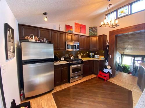 107 Oakfern Way Sw, Calgary, AB - Indoor Photo Showing Kitchen With Stainless Steel Kitchen