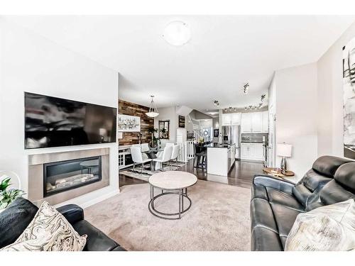 83 Evansborough Common Nw, Calgary, AB - Indoor Photo Showing Living Room With Fireplace