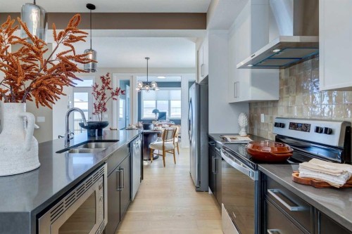 422 River Avenue, Cochrane, AB - Indoor Photo Showing Kitchen With Stainless Steel Kitchen With Double Sink With Upgraded Kitchen