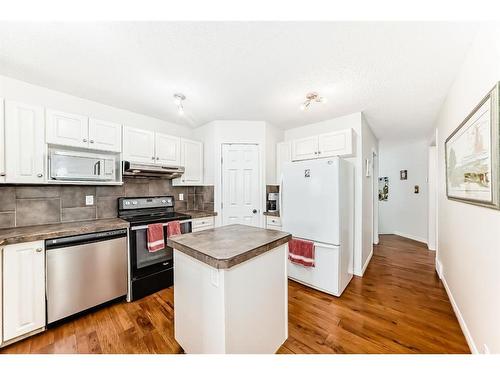 76 Bridleridge Gardens Sw, Calgary, AB - Indoor Photo Showing Kitchen