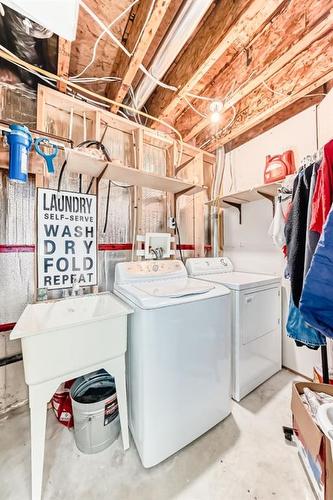 76 Bridleridge Gardens Sw, Calgary, AB - Indoor Photo Showing Laundry Room