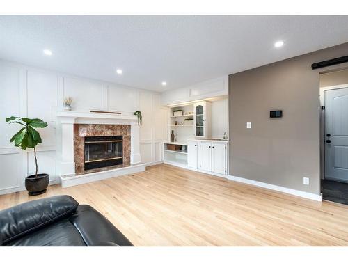 1393 Shawnee Road Sw, Calgary, AB - Indoor Photo Showing Living Room With Fireplace