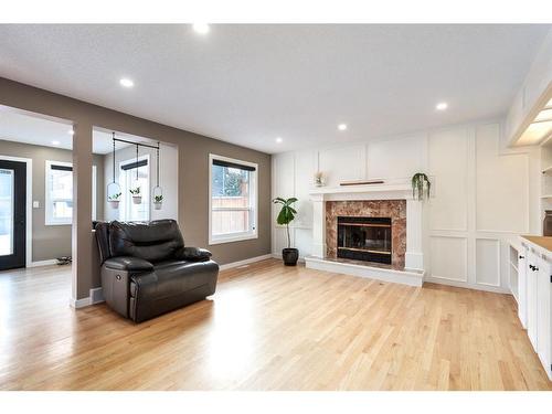 1393 Shawnee Road Sw, Calgary, AB - Indoor Photo Showing Living Room With Fireplace