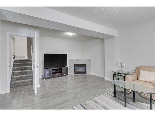 58 Anaheim Place Ne, Calgary, AB - Indoor With Fireplace