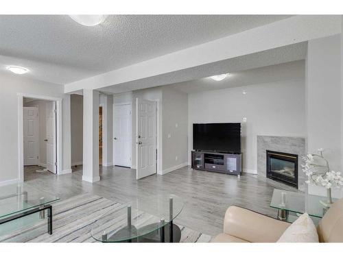 58 Anaheim Place Ne, Calgary, AB - Indoor Photo Showing Living Room With Fireplace