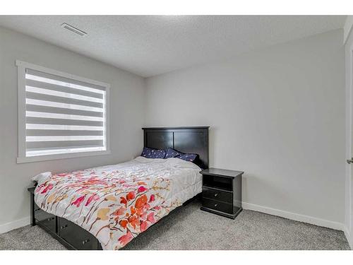 58 Anaheim Place Ne, Calgary, AB - Indoor Photo Showing Living Room With Fireplace