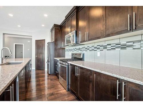 228 Cranarch Crescent Se, Calgary, AB - Indoor Photo Showing Kitchen With Upgraded Kitchen