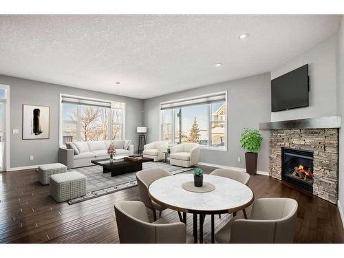 228 Cranarch Crescent Se, Calgary, AB - Indoor Photo Showing Living Room With Fireplace