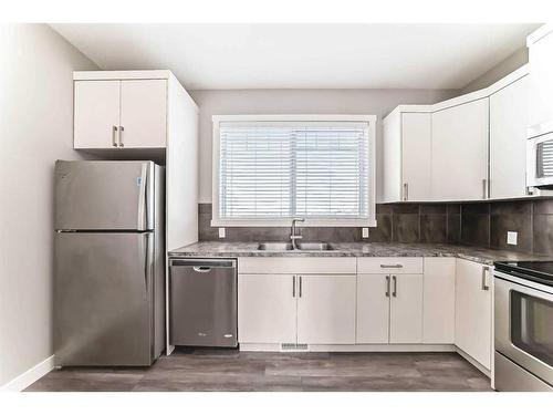 1517 Symons Valley Parkway Nw, Calgary, AB - Indoor Photo Showing Kitchen With Stainless Steel Kitchen With Double Sink