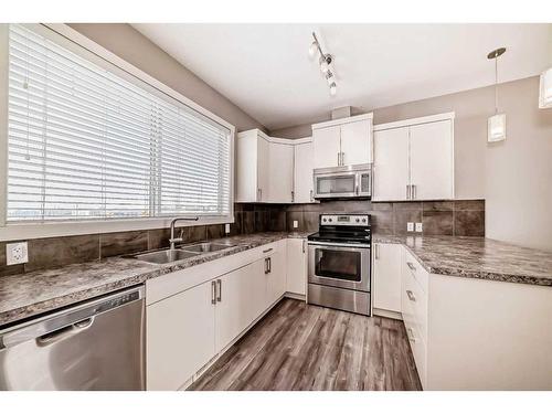 1517 Symons Valley Parkway Nw, Calgary, AB - Indoor Photo Showing Kitchen With Stainless Steel Kitchen With Double Sink