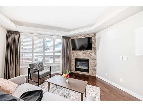 3327 40 Street Sw, Calgary, AB - Indoor Photo Showing Living Room With Fireplace