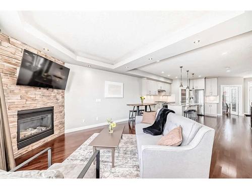 3327 40 Street Sw, Calgary, AB - Indoor Photo Showing Living Room With Fireplace