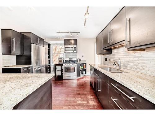 2125 36 Avenue Sw, Calgary, AB - Indoor Photo Showing Kitchen With Double Sink With Upgraded Kitchen