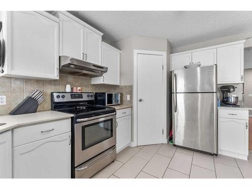 59 Mt Apex Green Se, Calgary, AB - Indoor Photo Showing Kitchen With Stainless Steel Kitchen