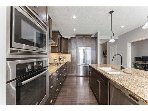 7 Copperleaf Terrace Se, Calgary, AB - Indoor Photo Showing Kitchen With Double Sink With Upgraded Kitchen