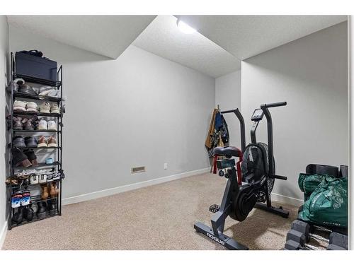 7 Copperleaf Terrace Se, Calgary, AB - Indoor Photo Showing Gym Room