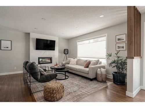 47 Henefer Road Sw, Calgary, AB - Indoor Photo Showing Living Room With Fireplace