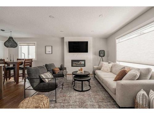 47 Henefer Road Sw, Calgary, AB - Indoor Photo Showing Living Room With Fireplace