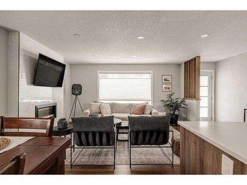 47 Henefer Road Sw, Calgary, AB - Indoor Photo Showing Living Room With Fireplace