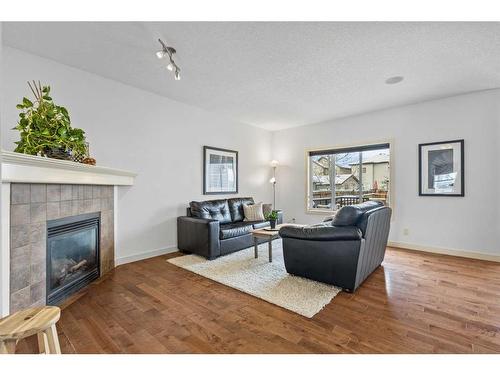 43 Elgin Terrace Se, Calgary, AB - Indoor Photo Showing Living Room With Fireplace