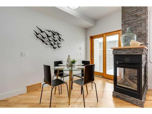 2325 22 Avenue Sw, Calgary, AB - Indoor Photo Showing Dining Room With Fireplace