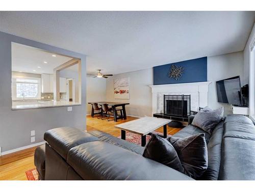 939 Cannock Road Sw, Calgary, AB - Indoor Photo Showing Living Room With Fireplace