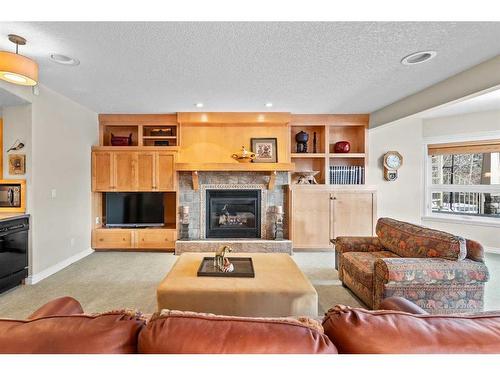 22 Strathridge Grove Sw, Calgary, AB - Indoor Photo Showing Living Room With Fireplace