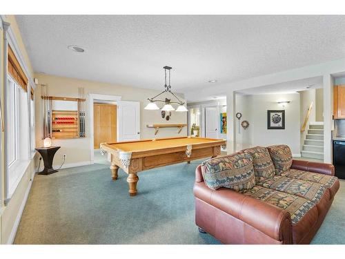 22 Strathridge Grove Sw, Calgary, AB - Indoor With Fireplace