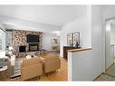 1015 Motherwell Road Ne, Calgary, AB  - Indoor Photo Showing Living Room With Fireplace 