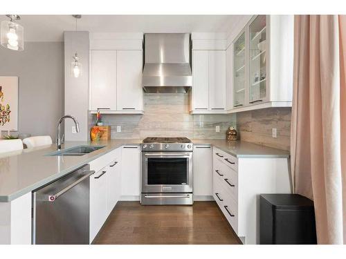 120 Burma Star Road Sw, Calgary, AB - Indoor Photo Showing Kitchen With Double Sink With Upgraded Kitchen