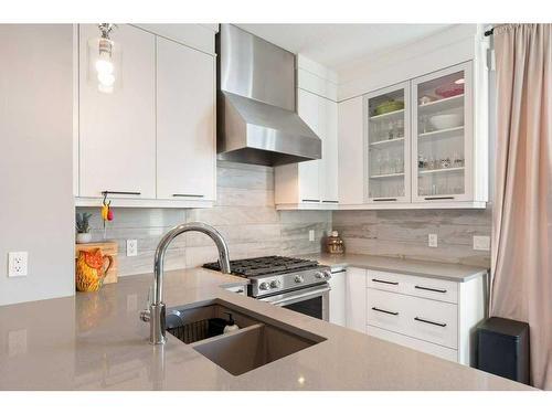 120 Burma Star Road Sw, Calgary, AB - Indoor Photo Showing Kitchen With Double Sink With Upgraded Kitchen