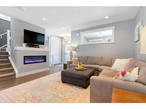 120 Burma Star Road Sw, Calgary, AB - Indoor Photo Showing Living Room With Fireplace