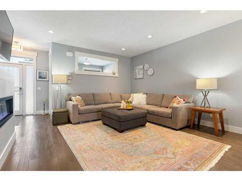 120 Burma Star Road Sw, Calgary, AB - Indoor Photo Showing Living Room With Fireplace