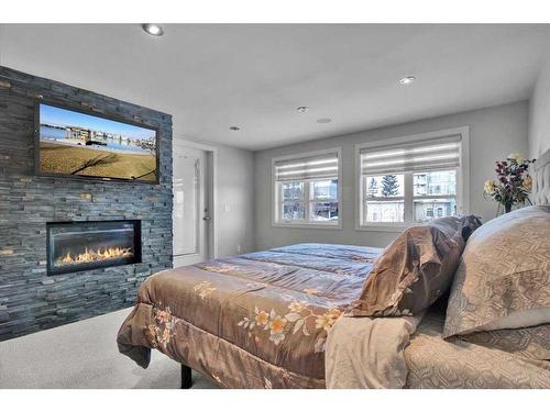 1907 Westmount Road Nw, Calgary, AB - Indoor Photo Showing Bedroom With Fireplace