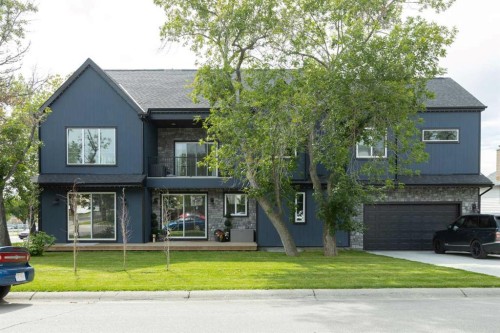 116 Centre Avenue Ne, Airdrie, AB - Outdoor With Facade