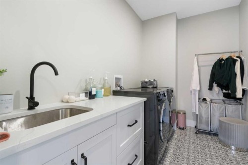 116 Centre Avenue Ne, Airdrie, AB - Indoor Photo Showing Laundry Room