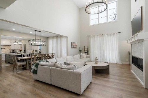 116 Centre Avenue Ne, Airdrie, AB - Indoor Photo Showing Living Room With Fireplace