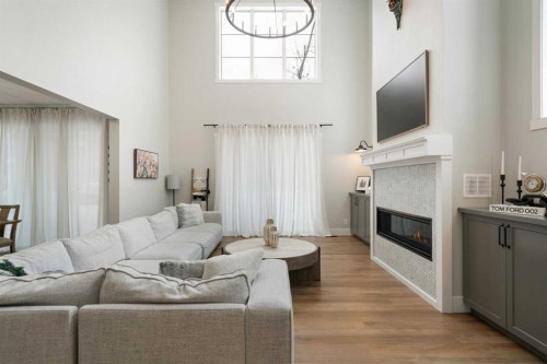 116 Centre Avenue Ne, Airdrie, AB - Indoor Photo Showing Living Room With Fireplace