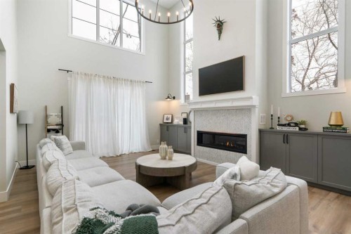 116 Centre Avenue Ne, Airdrie, AB - Indoor Photo Showing Living Room With Fireplace