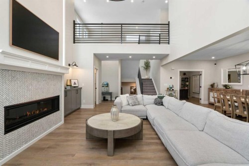 116 Centre Avenue Ne, Airdrie, AB - Indoor Photo Showing Living Room With Fireplace