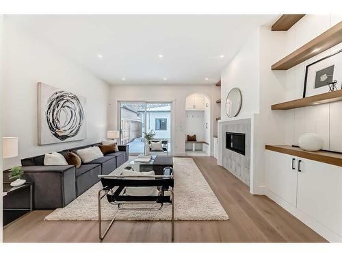 222 28 Avenue Nw, Calgary, AB - Indoor Photo Showing Living Room With Fireplace