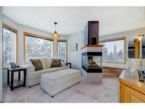 63 Woodpark Close Sw, Calgary, AB - Indoor Photo Showing Living Room With Fireplace